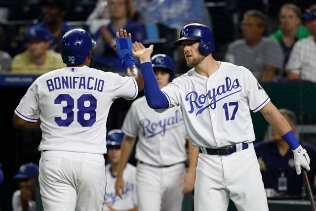 Royals beat Blue Jays 6-2 after long delay to split series